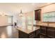 Open kitchen with granite countertops and stainless steel appliances flows into the living area at 219 Sleepy Way, Canton, GA 30114