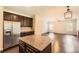 Bright kitchen with granite counters, stainless steel appliances, and a center island at 219 Sleepy Way, Canton, GA 30114