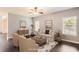 Comfortable living room with hardwood floors, neutral decor, and ample natural light at 219 Sleepy Way, Canton, GA 30114