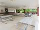 Community pavilion area with multiple picnic tables and ceiling fans for outdoor enjoyment at 219 Sleepy Way, Canton, GA 30114