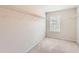 Spacious walk-in closet with carpeting and a window for natural light at 219 Sleepy Way, Canton, GA 30114