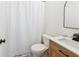 Modern bathroom featuring a stylish vanity, a sleek toilet, and a shower with a new white shower curtain at 2720 Stillwater Lake Ln, Marietta, GA 30066