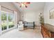 Bright Bedroom featuring a vaulted ceiling, plush carpet, a modern crib, and large windows for natural light at 2720 Stillwater Lake Ln, Marietta, GA 30066