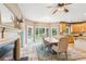 Bright breakfast nook with fireplace, travertine floors, large windows, and access to the backyard at 2720 Stillwater Lake Ln, Marietta, GA 30066