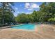 Community pool with ample seating and shaded areas at 2720 Stillwater Lake Ln, Marietta, GA 30066