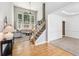 Bright foyer with hardwood floors and staircase leading to the second floor at 2720 Stillwater Lake Ln, Marietta, GA 30066