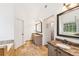 Luxurious main bathroom with double vanities, soaking tub, and travertine floors for a spa-like experience at 2720 Stillwater Lake Ln, Marietta, GA 30066
