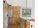 Luxurious bathroom boasts glass enclosed shower with bench and a soaking tub, perfect for relaxation at 2720 Stillwater Lake Ln, Marietta, GA 30066