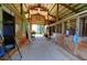 Inside a horse barn featuring individual stalls with wooden doors and metal bars at 4393 Cannon Rd, Loganville, GA 30052