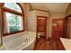 This bathroom has a soaking tub, and a separate toilet room at 4393 Cannon Rd, Loganville, GA 30052