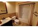 Bathroom featuring tiled walls and floors, a bath tub shower enclosure, and a dark wood vanity at 4393 Cannon Rd, Loganville, GA 30052