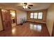 Bedroom with hardwood floors, a window seat, and a door leading into the bathroom at 4393 Cannon Rd, Loganville, GA 30052
