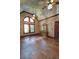 This bedroom features a vaulted ceiling, wood floors, and natural light through large windows at 4393 Cannon Rd, Loganville, GA 30052