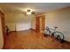 Bedroom featuring hardwood floors, a ceiling fan, and a guitar in the corner of the room at 4393 Cannon Rd, Loganville, GA 30052