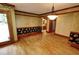 The dining room features hardwood floors, unique wall decor, and a modern chandelier at 4393 Cannon Rd, Loganville, GA 30052