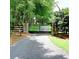 Gated entrance to a sprawling estate with mature trees and long driveway leading to the property at 4393 Cannon Rd, Loganville, GA 30052