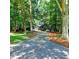 Charming home featuring mature trees and a long driveway providing seclusion and curb appeal at 4393 Cannon Rd, Loganville, GA 30052
