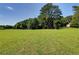 Expansive grassy field offering plenty of space for outdoor activities and recreation at 4393 Cannon Rd, Loganville, GA 30052