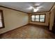 An inviting living room with tile floors, natural lighting, and a ceiling fan at 4393 Cannon Rd, Loganville, GA 30052