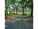 Expansive green field with mature trees and a black fence visible in the distance at 4393 Cannon Rd, Loganville, GA 30052