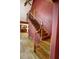 Staircase with wood floors and black metal railings that leads to the second floor of the home at 4393 Cannon Rd, Loganville, GA 30052