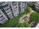 Aerial view of lush community garden with walking paths, fountain, mature trees, and benches, offering a peaceful retreat at 855 Peachtree Ne St # 3304, Atlanta, GA 30308
