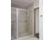 Modern bathroom featuring a glass-enclosed shower with gray tiled walls and sleek fixtures at 855 Peachtree Ne St # 3304, Atlanta, GA 30308