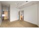 Open-concept bedroom featuring modern lighting, neutral carpeting, and entry door at 855 Peachtree Ne St # 3304, Atlanta, GA 30308