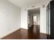 Spacious bedroom with hardwood floors, neutral walls, and a doorway leading to a bathroom at 855 Peachtree Ne St # 3304, Atlanta, GA 30308