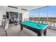 Relax in the game room with a pool table and city views at 855 Peachtree Ne St # 3304, Atlanta, GA 30308