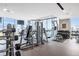 Fully equipped gym with floor-to-ceiling windows overlooking city views at 855 Peachtree Ne St # 3304, Atlanta, GA 30308