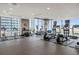 Brightly lit gym featuring cardio machines and floor-to-ceiling windows with amazing views at 855 Peachtree Ne St # 3304, Atlanta, GA 30308