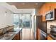 Modern kitchen featuring granite countertops, stainless steel appliances, and a stunning city view at 855 Peachtree Ne St # 3304, Atlanta, GA 30308