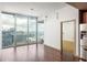 Bright living room with hardwood floors, city views, and modern finishes at 855 Peachtree Ne St # 3304, Atlanta, GA 30308
