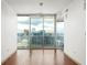 Minimalist living space with hardwood floors and stunning city skyline view at 855 Peachtree Ne St # 3304, Atlanta, GA 30308