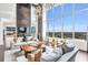 Light-filled living room featuring high ceilings and incredible views of the city skyline at 855 Peachtree Ne St # 3304, Atlanta, GA 30308