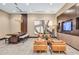 Stylish lounge area with modern lighting, a long wooden table, comfortable chairs and TV, great for socializing and relaxing at 855 Peachtree Ne St # 3304, Atlanta, GA 30308