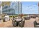 Outdoor grilling area with stainless steel grill, dining tables and chairs ideal for outdoor cooking and dining at 855 Peachtree Ne St # 3304, Atlanta, GA 30308