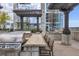 Outdoor kitchen and grilling area with stainless steel grill, counter space, and seating under pergola perfect for entertaining at 855 Peachtree Ne St # 3304, Atlanta, GA 30308