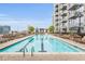 Inviting swimming pool with lounge chairs perfect for relaxing and enjoying a refreshing swim at 855 Peachtree Ne St # 3304, Atlanta, GA 30308