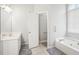 Spacious bathroom with double vanity, soaking tub and tile floors at 1010 Capella Creek Way, Grayson, GA 30017
