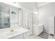 Spacious bathroom featuring dual vanities, jacuzzi tub and glass shower at 1010 Capella Creek Way, Grayson, GA 30017