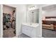 Bright bathroom vanity next to walk-in closet and Primary bedroom entrance at 1010 Capella Creek Way, Grayson, GA 30017