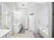 Large bathroom with dual vanities, jacuzzi tub and stand up shower at 1010 Capella Creek Way, Grayson, GA 30017