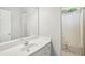 Neutral bathroom with a single vanity, shower and tub at 1010 Capella Creek Way, Grayson, GA 30017