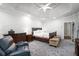 Large main bedroom with trey ceilings, sitting area and plush carpet at 1010 Capella Creek Way, Grayson, GA 30017