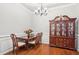 Elegant dining room with hardwood floors and traditional wooden furniture at 1010 Capella Creek Way, Grayson, GA 30017