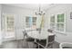 Bright eat-in kitchen boasts a modern chandelier and exterior access at 1010 Capella Creek Way, Grayson, GA 30017
