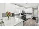 Modern kitchen featuring stainless appliances, quartz countertops and stylish finishes at 1010 Capella Creek Way, Grayson, GA 30017