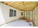 Exterior view of a patio with stone pavers and wood beam ceiling, perfect for outdoor entertaining or relaxing at 1010 Capella Creek Way, Grayson, GA 30017